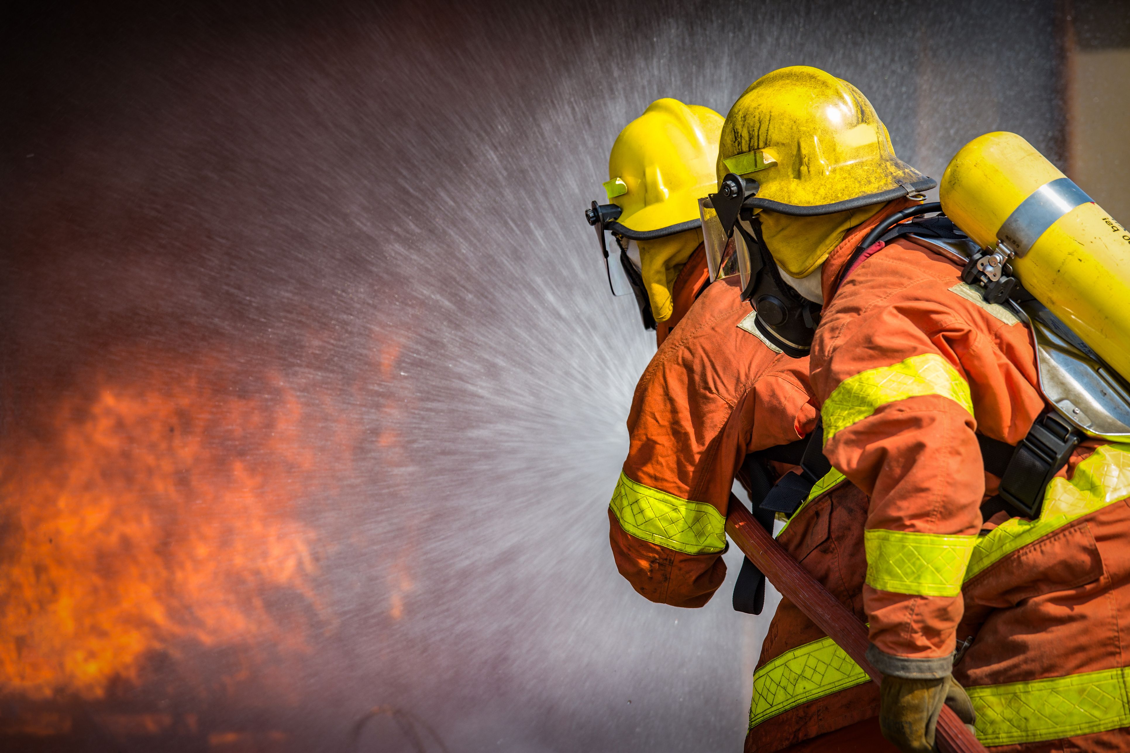PE1222_firefighters spraying high-pressure water.jpg