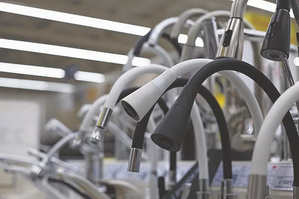 TW1123_mass of kitchen faucets on display.jpg