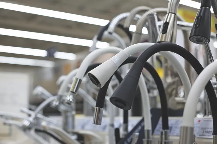 TW1123_mass of kitchen faucets on display.jpg