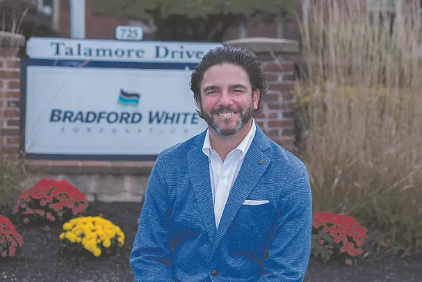 Jim in front of sign.jpg