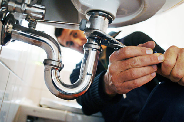 PHCN0324_plumber repairing sink.jpg