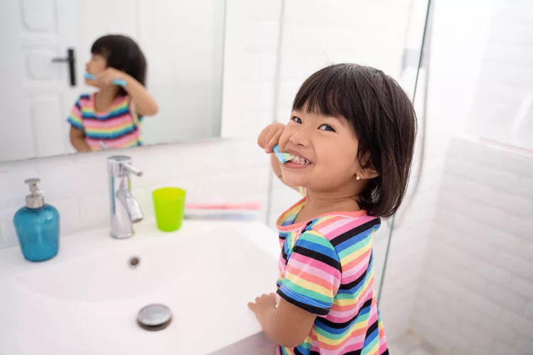 PE0325_little girl brushing teeth.jpg