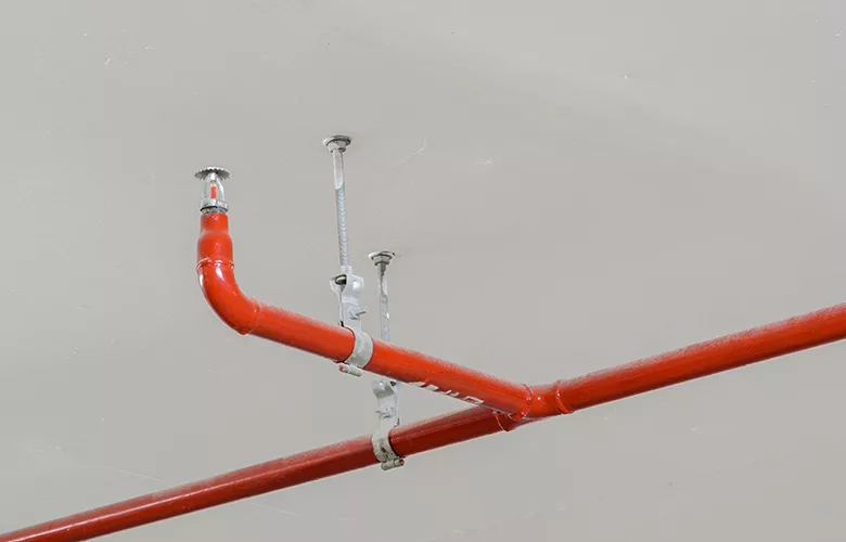 PE0525_red sprinkler pipe with hangers.jpg