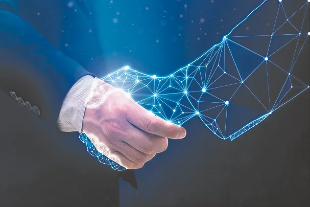 TW0425_Businessperson shaking hand with digital partner.jpg