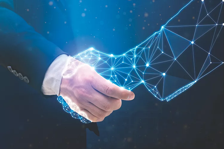 TW0425_Businessperson shaking hand with digital partner.jpg