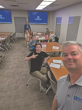 TW0725_Charlie Parham and university students.jpg