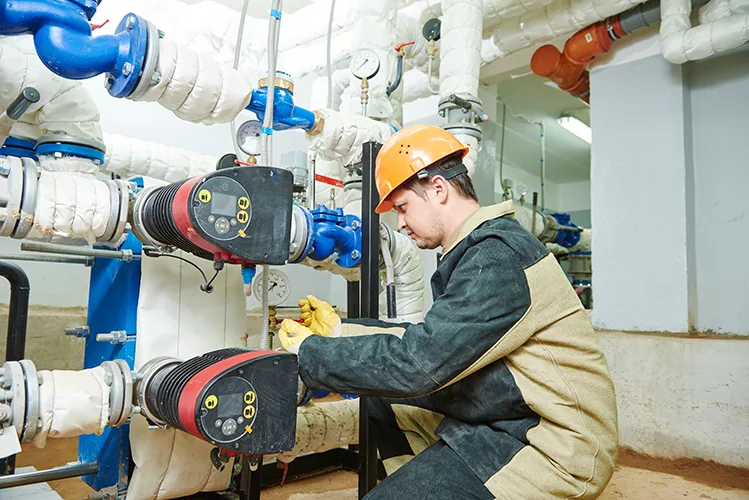 1125_Plumbing technician works with water pump.jpg