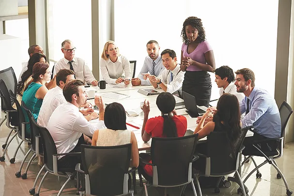 TW0726_businesswomen speaking to colleagues.jpg