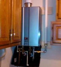 Using drain pans to solve tankless water heater leak problems